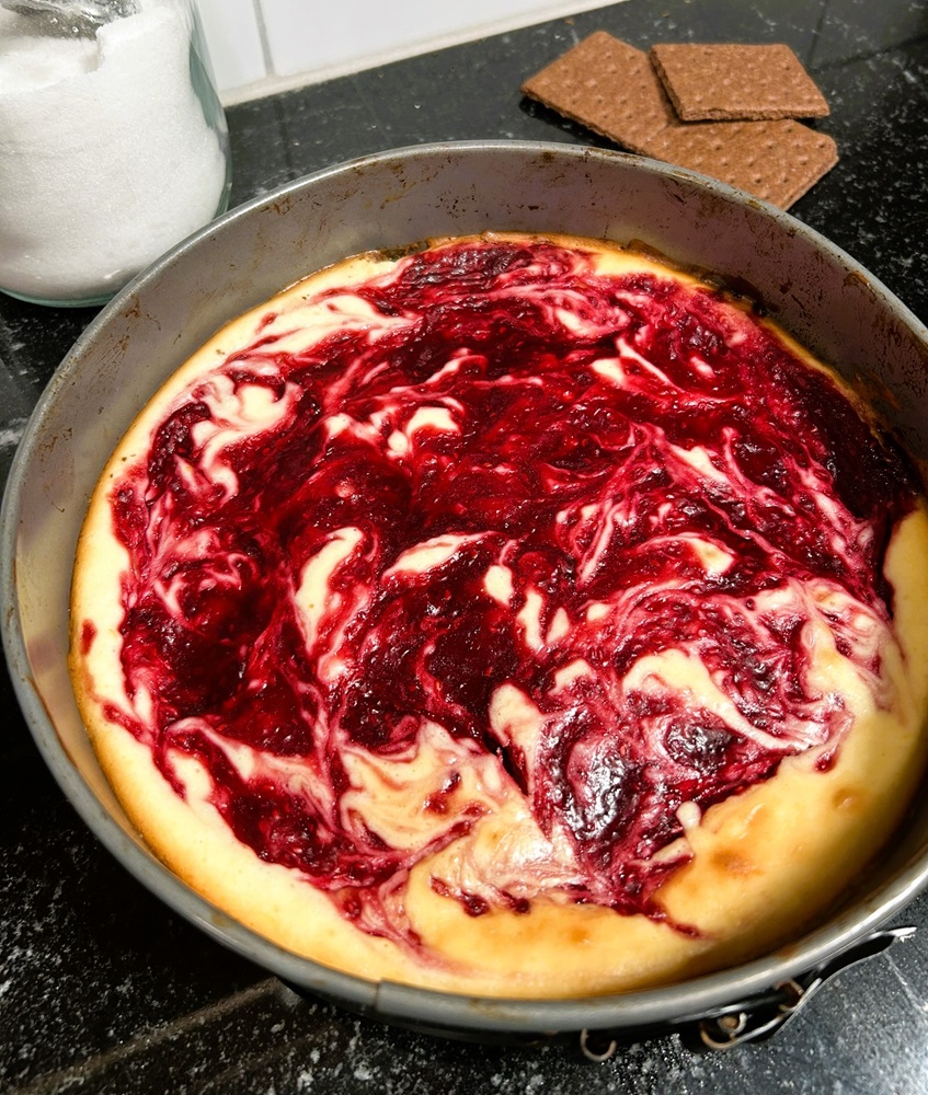 Raspberry swirl cheesecake baked